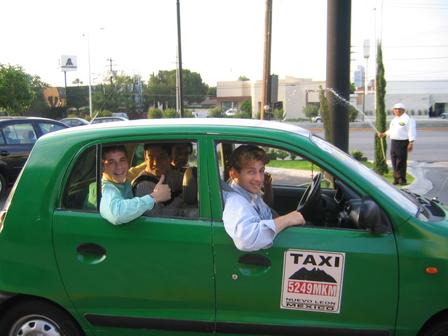 Guys enjoying Monterrey taxi cab